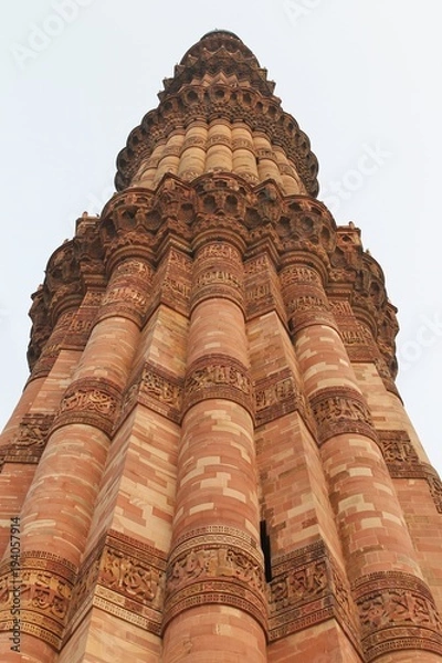 Fototapeta New Delhi, India - October 2014: Vertical close up view of Qutub Minar