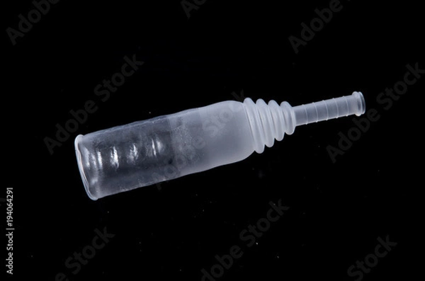 Fototapeta external condom catheter at the black background isolated