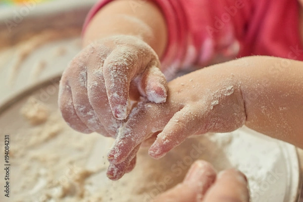 Obraz Child hands mixing flour
