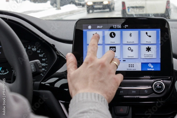 Fototapeta managing infotainment system while driving