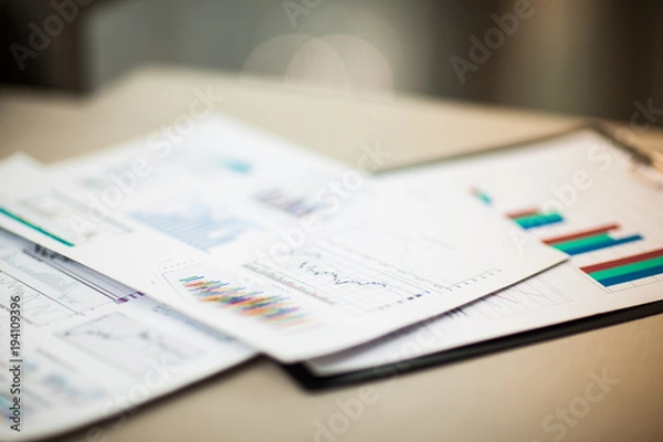 Fototapeta financial charts and graphs on the table