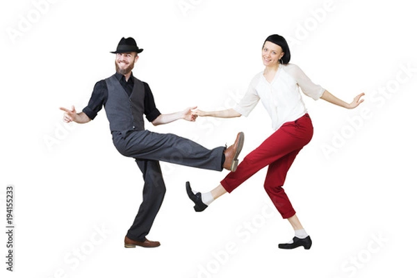 Fototapeta Lindy hop or rock'n'roll dance boogie woogie. Boogie acrobatic stunt in a studio background. Dance for rock-n-roll music.