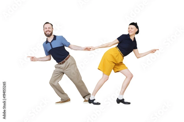 Fototapeta Lindy hop or rock'n'roll dance boogie woogie. Boogie acrobatic stunt in a studio background. Dance for rock-n-roll music.