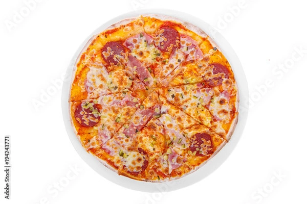 Fototapeta Pizza whole round, cut into pieces, on a white isolated background. Fast food in a pizzeria, a floury cheese product. View from above