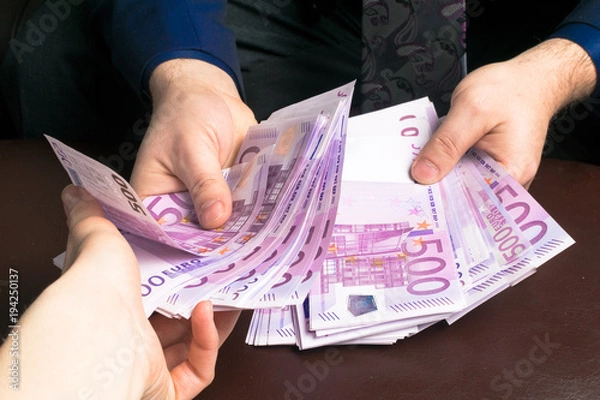 Obraz Human hands exchanging money - closeup shot