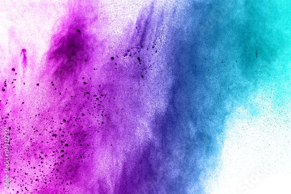 Obraz abstract explosion of blue purple dust on white background.Abstract blue purple powder splatter on white  background. Freeze motion of blue purple powder splash.