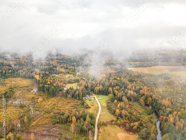 Fototapeta Aerial of North European countryside on a cloudy day