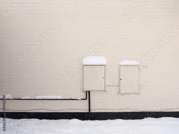 Fototapeta outside of house with electrical and gas white box points uk power energy meter