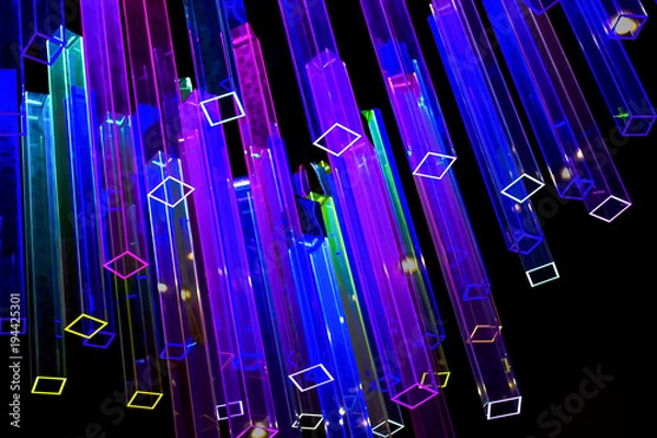 Obraz Abstract black background with light colored neon prisms