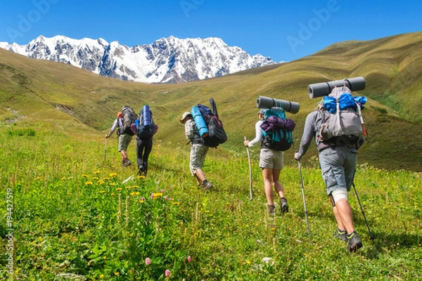 Obraz Group of tourists with large backpacks are on mountain