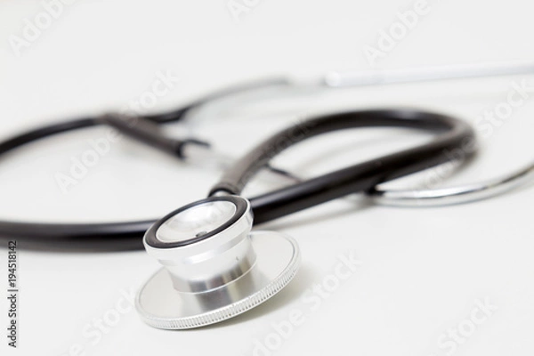 Obraz Stethoscope on table. Isolated on white background. Studio lighting. Concept for healthy and medical