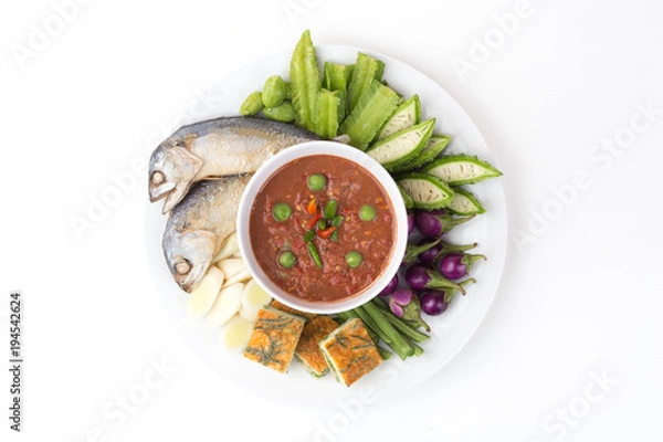 Obraz Fried Mackerel with Shrimp Paste Sauce,Thai shrimp paste (Nam prik kapi) Thai traditional food with fresh vegetables on white background.