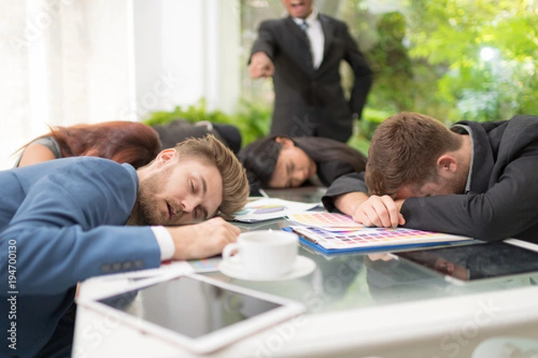 Fototapeta In selective focus of Business people sleeping in the conference room during a meeting.