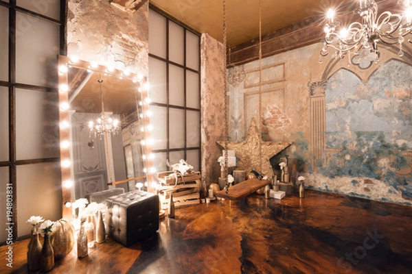 Fototapeta Loft interior with mirror, candles, brick wall, large window, living room, coffee table in modern design