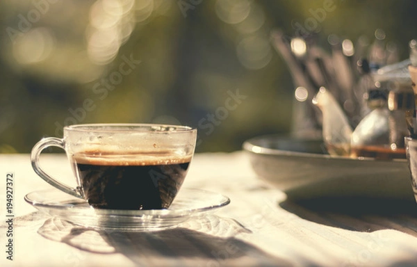 Fototapeta Cup of coffee on table in coffee shop 