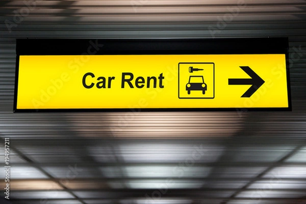 Fototapeta znak ze strzałką punkt, aby wynająć samochód na lotnisku dla pasażera, który chce ukryć samochód na podróż po mieście. transport wolności dla wygodnej podróży