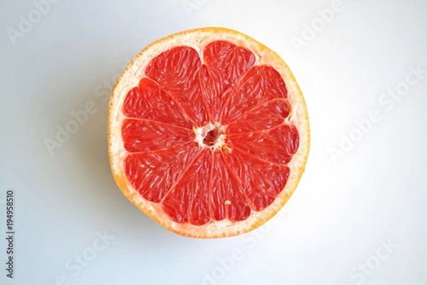 Obraz Juicy grapefruit half isolated on white background close up