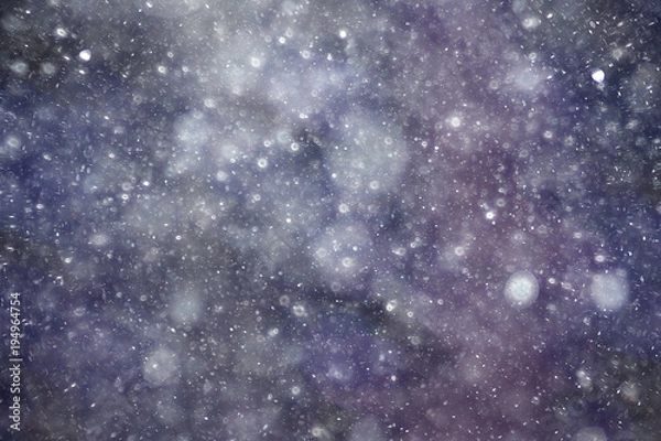 Fototapeta Snowfall texture of snowflakes on blurred background