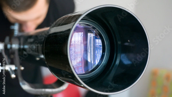 Fototapeta Man looking in telescope