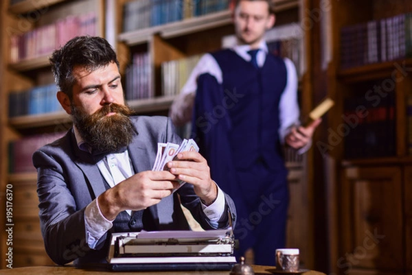 Fototapeta Men in suits with busy faces. Writer counts honorarium