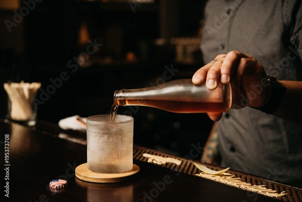 Obraz Pouring from glass bottle