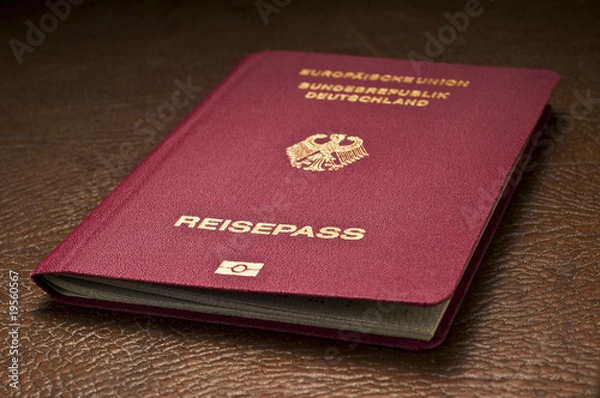 Obraz german passport on leather baggage