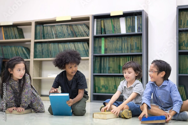 Fototapeta Happy kids reading on the floor, Education lifestlye in the Library. Young people explore lifestlye in the Library. Development of Human Resources in Education Concept. Setup studio shooting.