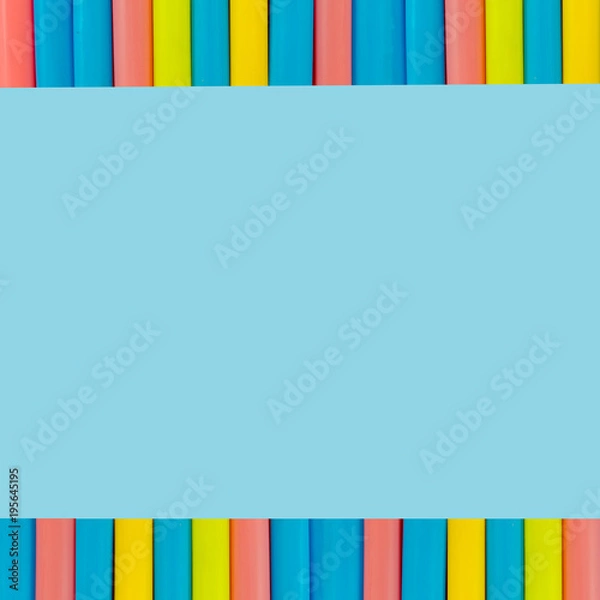 Obraz multi  Colorful pipe with copy space for your text on blue background. / education, creativity and feeling happy