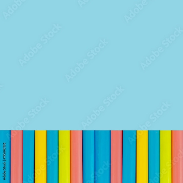 Obraz multi  Colorful pipe with copy space for your text on blue background. / education, creativity and feeling happy