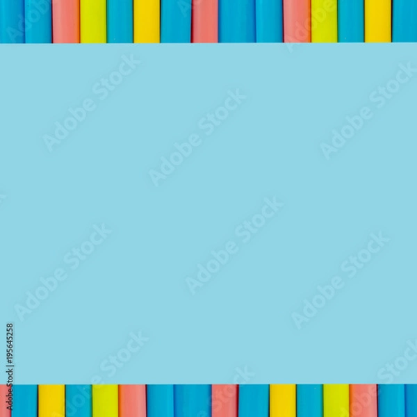 Obraz multi  Colorful pipe with copy space for your text on blue background. / education, creativity and feeling happy