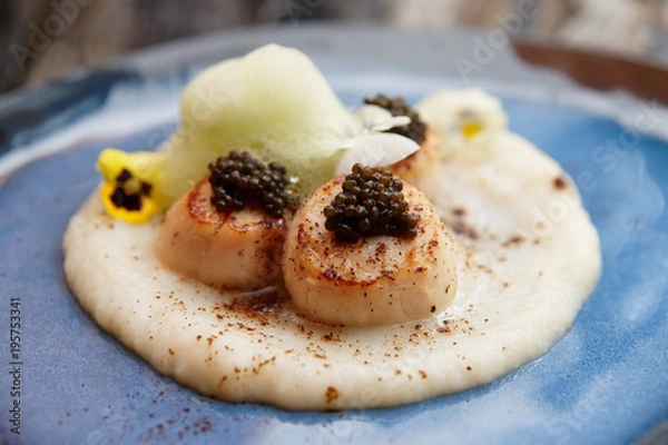 Fototapeta Grilled scallops with caviar and molecular froth