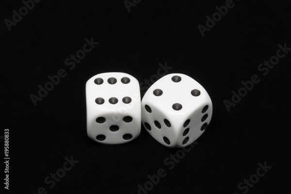 Fototapeta The dices are cast - two dices on a black background showing a total of ten eyes 