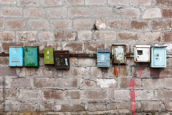 Obraz old mailboxes on an old dirty wall