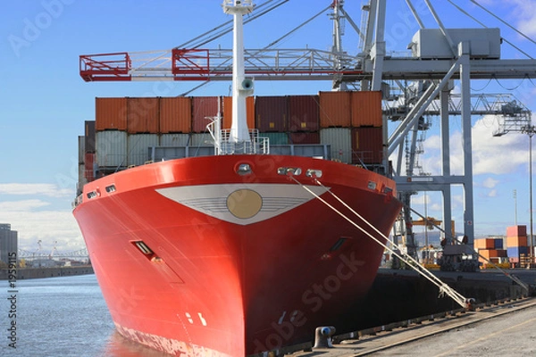 Fototapeta container ship being unloaded