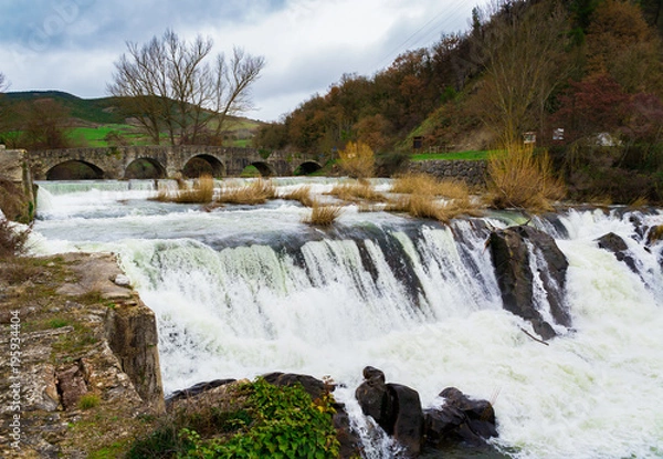 Obraz The famous Trinity Bridge, with the Ulzama River as it passes through Atarrabia, Navarra, Spain