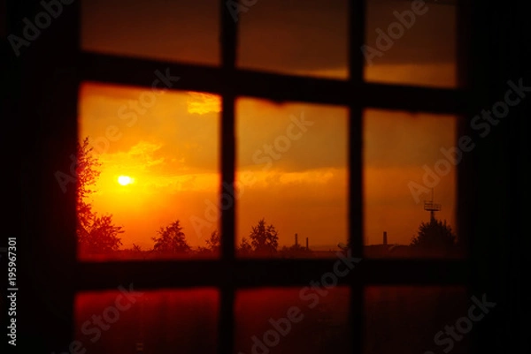 Obraz Landscape: fiery, bright sunset in the window