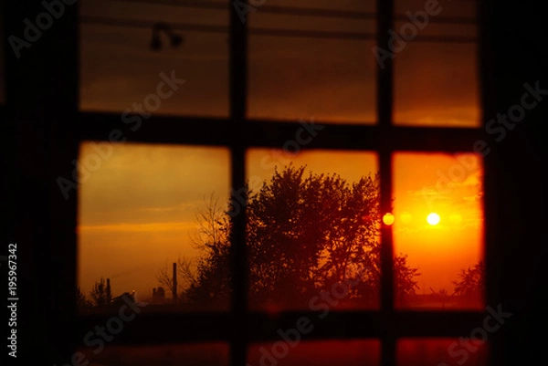 Obraz Landscape: fiery, bright sunset in the window