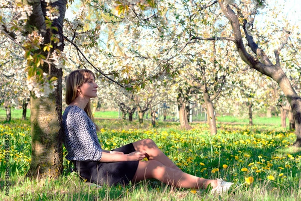 Obraz girl in a blooming spring garden