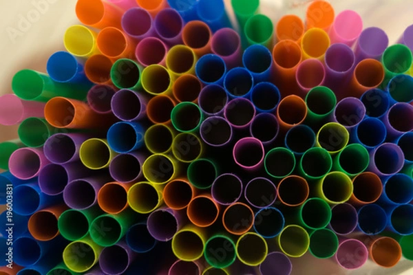 Fototapeta colored flexible straws in the glass isolated on white background .
