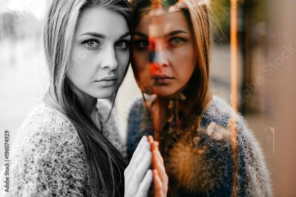 Obraz Self reflection portrait of amazing young girl in mirrored window. Unusual strange pretty woman person with sensual face looking at herself in showcase. Alter ego. Female state of mind. Other myself.