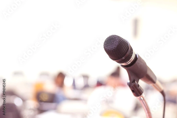 Fototapeta Close up microphone in conference on seminar room event background 