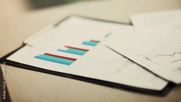 Fototapeta financial charts and graphs on the table