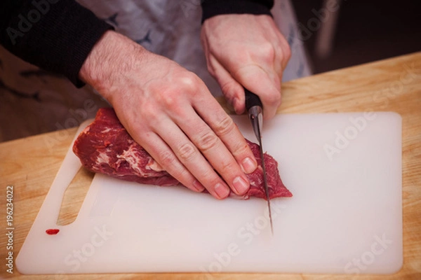 Obraz Cutting raw meat