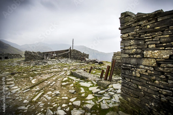 Obraz A hike along the English countryside up The Old Man of Coniston reveals an old abandoned slate mine, and a treasure trove of mining artifacts from hundreds of years ago.