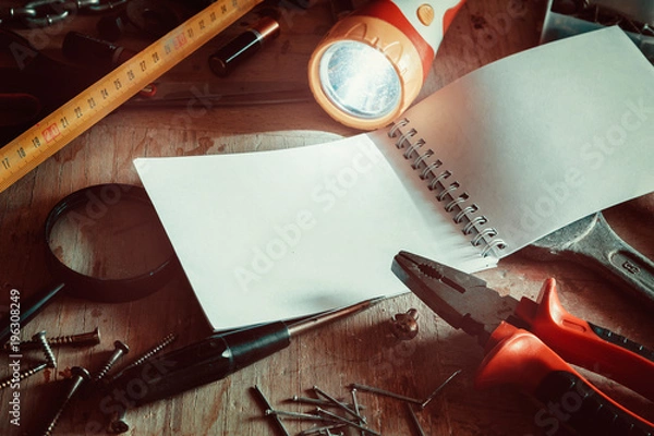 Obraz Workbench with notebook and pencil