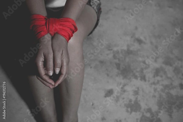 Fototapeta Woman bondage in angle of room, stop violence against Women, international women's day