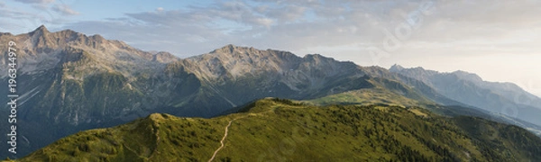 Fototapeta aerial image of green meadows in a mountain landscape at Isère