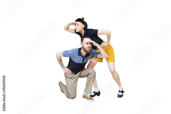Fototapeta Dancers are looking for something. Boogie or lindy hop in a studio background. Dance for rock-n-roll music.