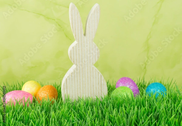 Obraz Easter bunny with Easter eggs in the meadow