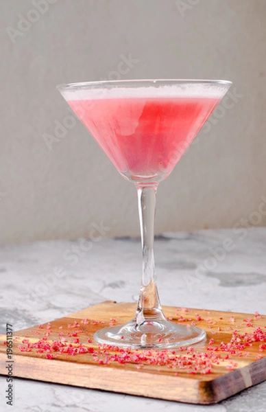 Obraz Top view red pink cocktail Margarita fresh in a martini glass on a wooden board, gray background. Bar alcohol drink menu, delicious tequila sunrise long drink.